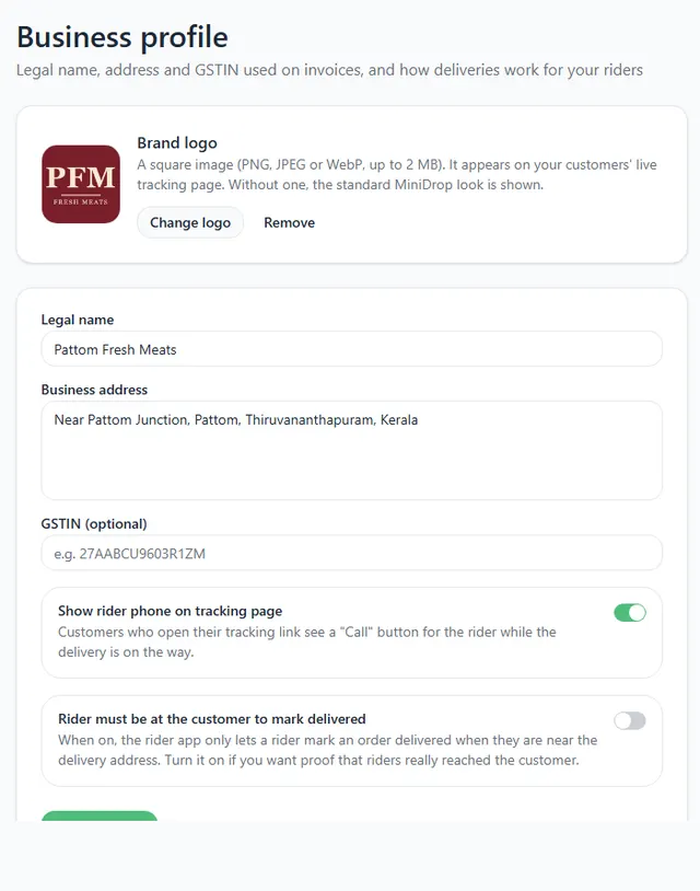 Business profile page with the brand logo box, legal name, business address and two switches